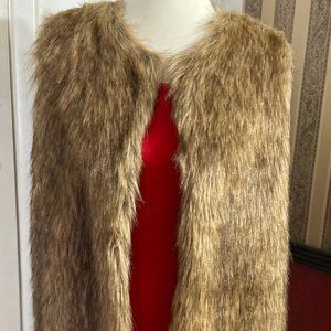 Sleeveless faux fur and knit vest.